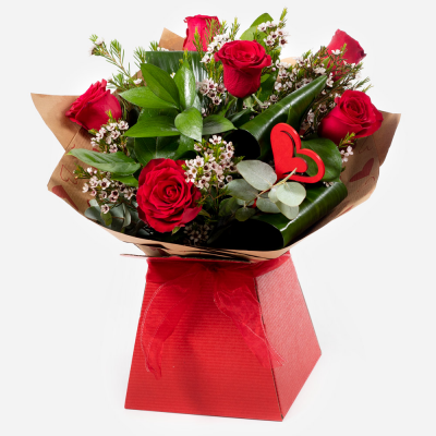 Kissing Booth - Who could resist you after receiving this selection of the beautiful red roses matched to the finest seasonal foliage.
